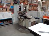 an image of a workshop with a lot of work equipment