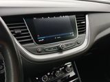 the dashboard of a car with a digital display in the center of it