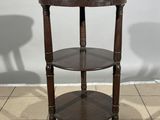an image of a corner table with two shelves