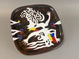 a plate with a design on it on a table