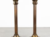pair of antique brass candlesticks with candles in the form of candlesticks