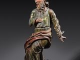 une statue représentant un homme barbu, avec une longue barbe
