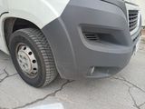 a picture of a truck with a flat tire on the side of the road