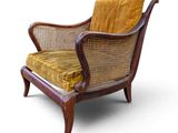 an image of a chair with a yellow cushion and a wooden frame