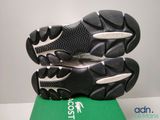 a close up of a pair of shoes on top of a box