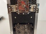 a close up of a metal case with a clock on top of it
