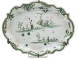 un plateau orné d'un motif vert et blanc