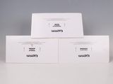three white envelopes sitting on top of each other on a table