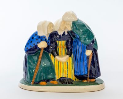 une image représentant une figurine de trois personnes tenant une canne