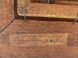 a close up of a piece of wood with a sign on it