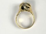 a gold ring with a black stone in it
