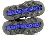 the soles of a pair of shoes with the word burberry on them