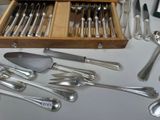 a wooden box filled with silverware on a table