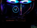 a close up of a computer case with two colorful lights on it