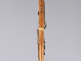 a wooden pen sitting on top of a clear display case