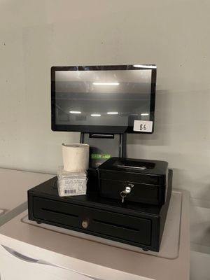 a cash register on top of a counter in a store