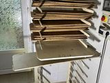 a stack of wood on a table in a room with a window