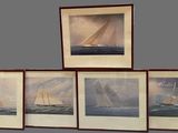 three framed pictures of sailboats in a row on a wall