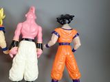 three action figures of gohan and vegeta standing next to each other