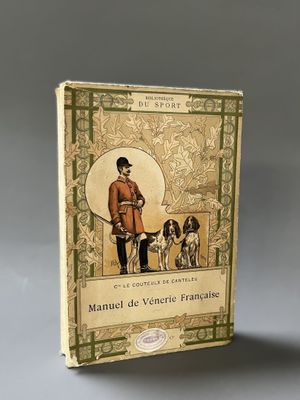 an old book with a picture of a man and two dogs
