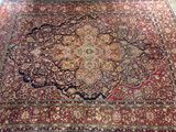 an image of a large oriental rug in a room