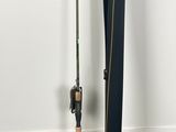 a fishing rod and a fishing pole next to a white wall