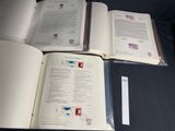three open books sitting on top of a table next to each other
