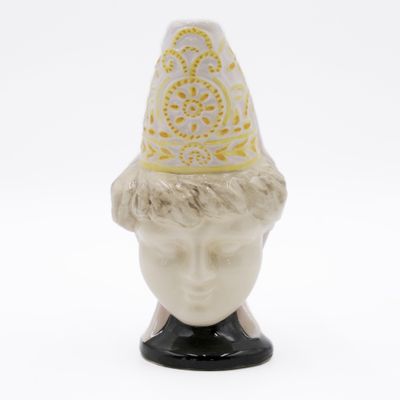 a small figurine of a man with a hat on his head