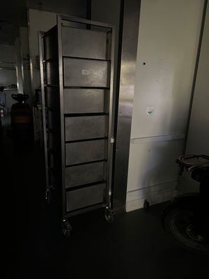 a tall metal cabinet in the middle of a dark room