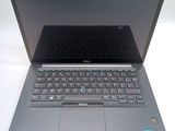 a laptop computer with a keyboard on a white surface