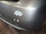 the front bumper of a car with a lot of scratches on it