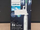 Brosse à dents électrique Philips Sonicare dans son emballage, posée sur une table en bois