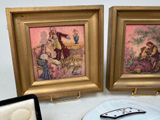 two framed pictures of a couple of people on a table