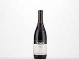 a bottle of red wine sitting on top of a table