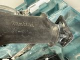 a close up of a person holding a tool in a case