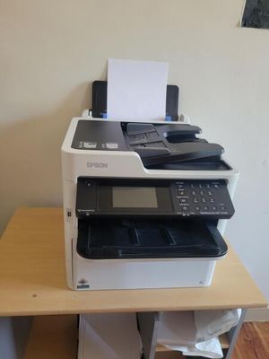 a printer that is sitting on top of a desk