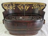 a wooden bench that has been carved into a barrel
