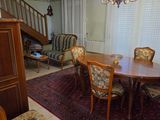 a dining room with a table and chairs in it