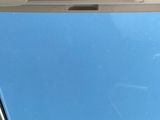 a picture of a person sitting in a car looking out the window