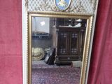 a large mirror with a picture of a man on it