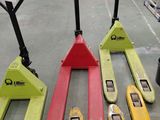 many different types of forklifts on display in a warehouse