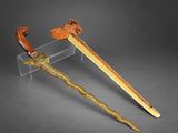 a wooden and metal sword with a wooden handle and a wooden handle