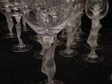 a lot of wine glasses that are sitting on a table