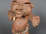 une image représentant une figurine en argile représentant un singe