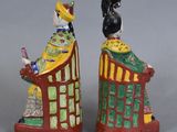 pair of chinese figurines of a lady and a man