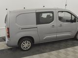 a picture of a silver van parked in a garage