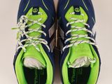 a pair of blue and green sneakers with white laces