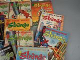 a lot of comic books that are on the table
