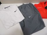 three pairs of men ' s nike tracksuits and a t - shirt