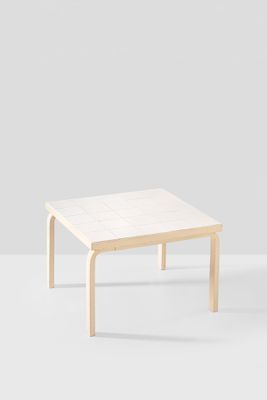 a white coffee table with a wooden frame on top of it